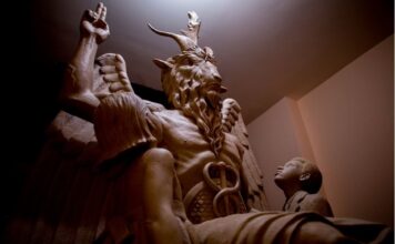 Peeking into The Satanic Temple Side view of Satanic Temple statue