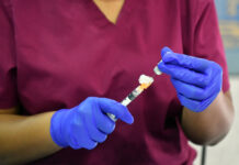 Pfizer-BioNTech COVID vaccine receives FDA approval Nurse prepping vaccine