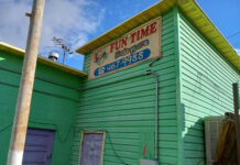 Officials: Day care known for conspiracy theories houses children safely Banner hanging outside Fun Time Kidz Care
