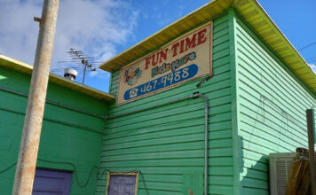 Officials: Day care known for conspiracy theories houses children safely Banner hanging outside Fun Time Kidz Care