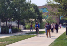 Pros and cons of coming back to campus Students walking outside