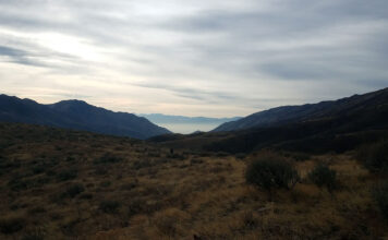 Worst air in the world: How SLCC students and staff feel about SLC’s air quality A view of two mountains coming together to create a canyon where thick pollution hangs in the air over Salt Lake City