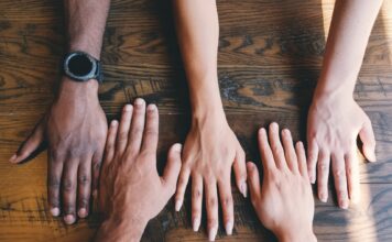 SLCC diversity office gives students a sense of belonging Five human hands on brown surface