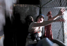 SLCC psychology professor explains why people like to be scared Haunted house worker scares a patron at Fear Factory