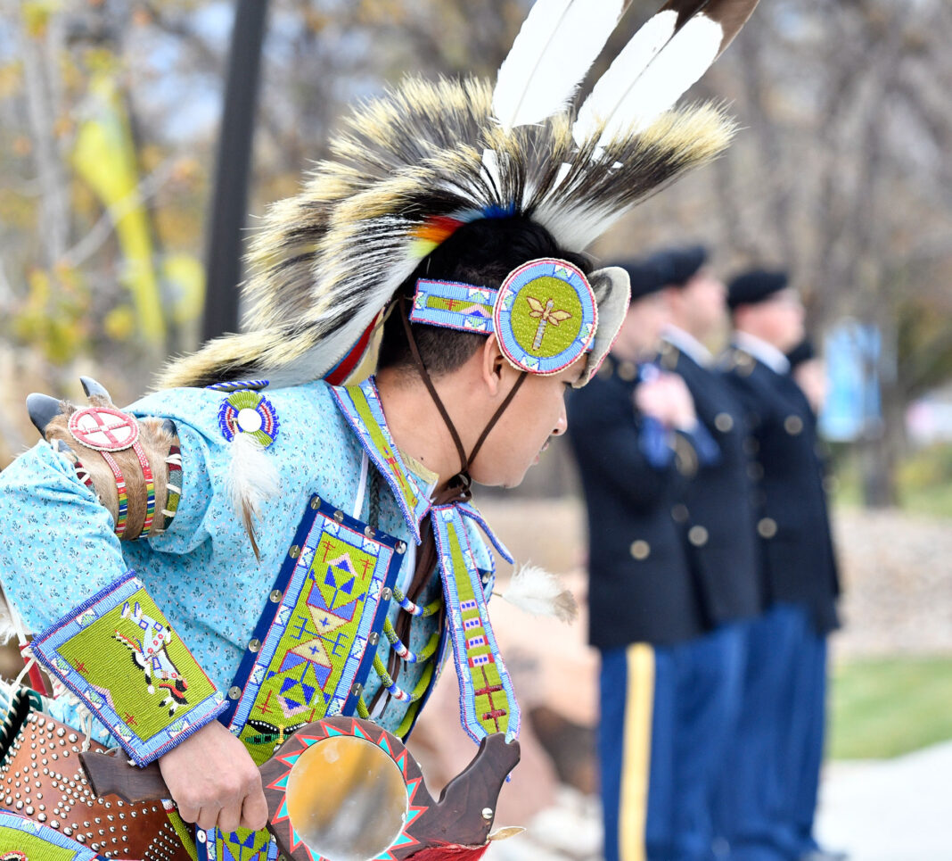 Eric Watchman performs a native dance