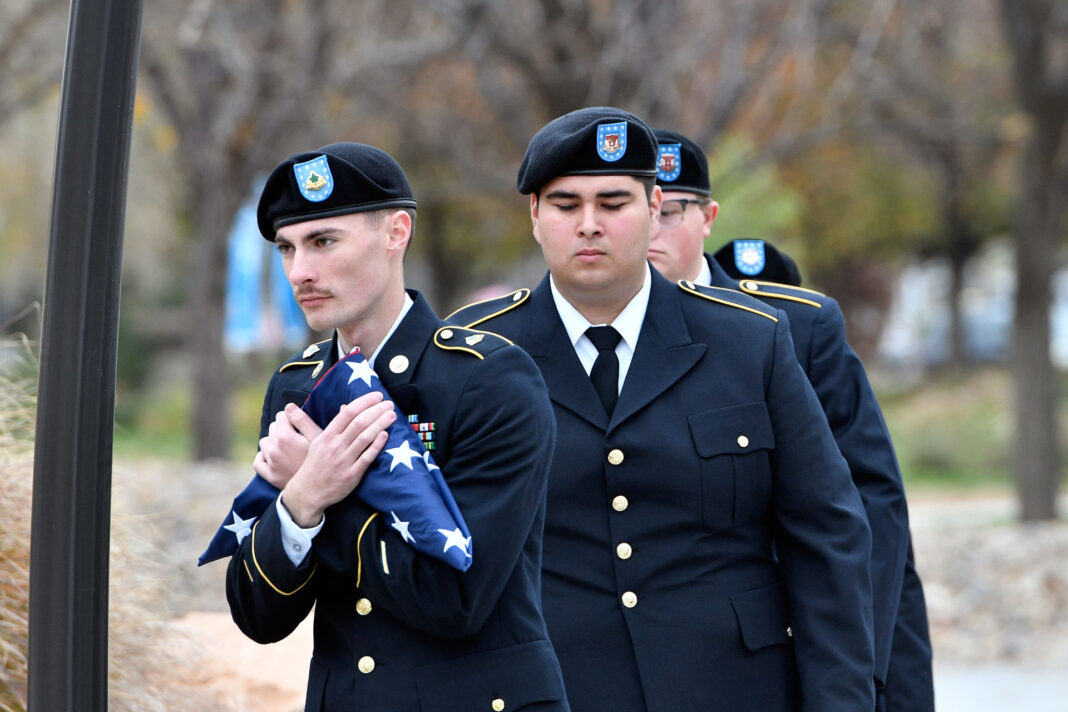 ROTC cadet carries American Flag