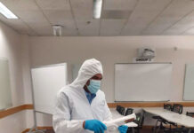 SLCC experiencing custodial staff shortage; down 42% Josh Auava'a cleans a room while wearing special protective clothing