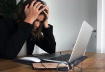 Stressed SLCC single parents struggle for balance A stressed woman hunched over her laptop