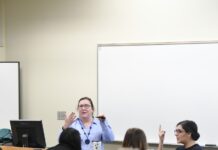 SLCC offers support for students with disabilities Francescia Paxton, seated right, interprets a teacher's lesson