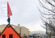 Salt Lake City planning to rebuild section of 2100 South Orange construction sign indicating a lane merge