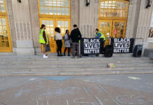 SLCC community holds solidarity event following racist message at South City Campus Chalk writing on sidewalk in front of entrance to South City Campus