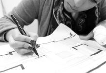 Students discuss challenges of learning while working Black-and-white photo of an architecture student