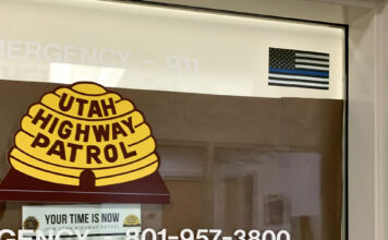 Thin Blue Line flag disappears from UHP office window at South City Campus Sticker on upper right corner of UHP window