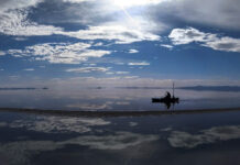 ‘Embrace the salt’ — A kayaker’s quest to share up-close views of an ‘epic’ but shriveling Great Salt Lake Man paddling a kayak across a lake