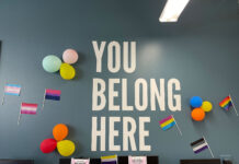 SLCC kicks off events for Pride Month Pride flags, balloons decorate an office wall with text that reads "you belong here"