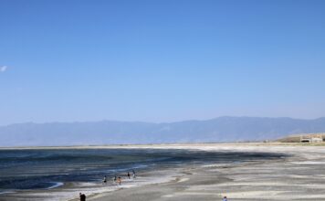 History lessons: Are Utahns ‘waking up’ to the Great Salt Lake’s peril? People visit Great Salt Lake, with Saltair and Wasatch Mountains in the horizon