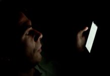 Americans are having less sex. Experts offer insight into why, and advice on how to move forward A Caucasian male whose face is lit up by a smartphone in a dark room