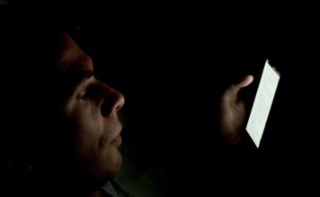 Americans are having less sex. Experts offer insight into why, and advice on how to move forward A Caucasian male whose face is lit up by a smartphone in a dark room