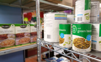 SLCC community has access to free food through Bruin Pantry Canned and boxed food on metal pantry shelves