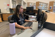 SLCC raises the starting wage for on-campus work Paulina David looks at a computer monitor