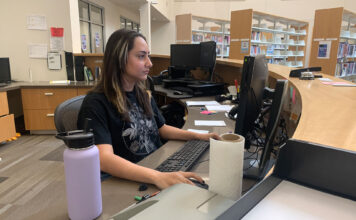 SLCC raises the starting wage for on-campus work Paulina David looks at a computer monitor