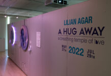 Art exhibit that opened at SLCC embraces Utah’s LGBTQ youth Display wall reads "Lilian Agar: A Hug Away - a breathing temple of love"