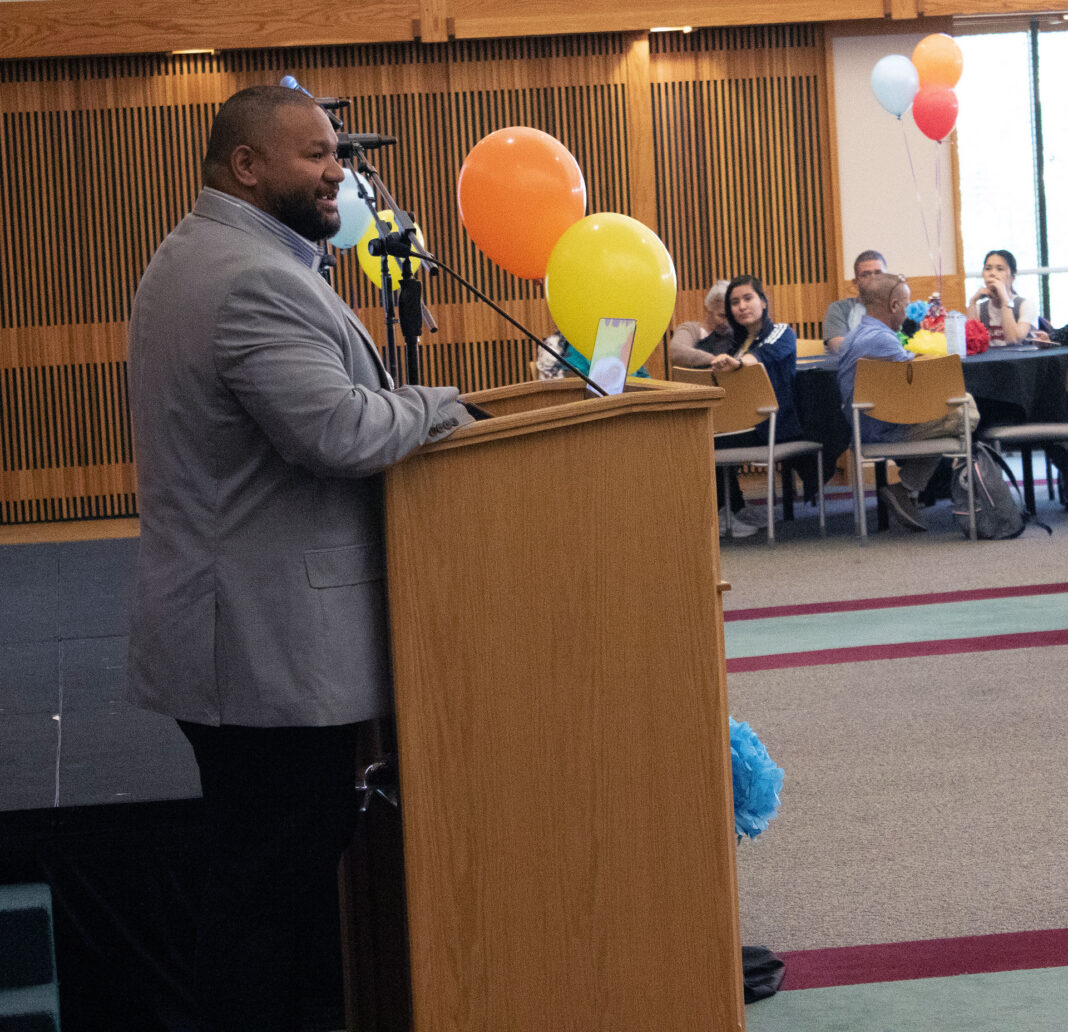 Ulysses Tonga'onevai stands at podium