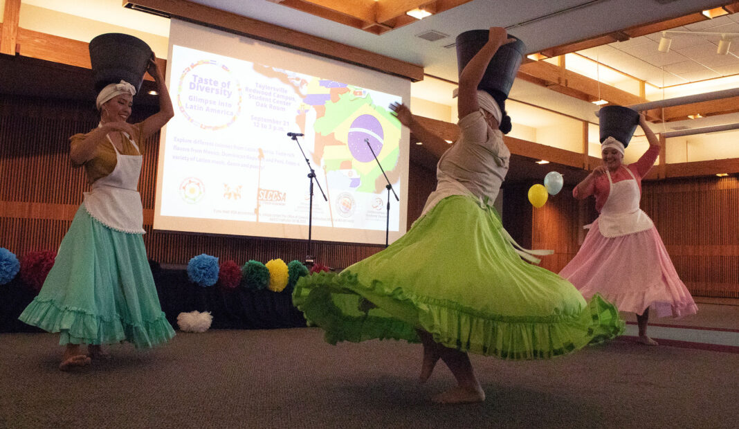 Three dancers spin around