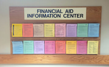 Without an exact date, the student debt relief application is set to arrive in October Financial aid information center board with fliers of various colors