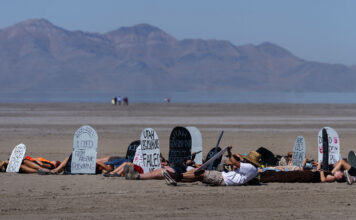 Utah youths hold ‘die-in’ for Great Salt Lake, challenge elected leaders to take bolder action Multiple people lie on the lakebed with makeshift tombstones