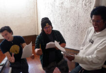 24-hour theatre festival showcases collective creativity Three students sing while holding scripts