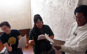 24-hour theatre festival showcases collective creativity Three students sing while holding scripts