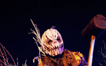 Globe staffers check out Nightmare on 13th’s 2022 showing, which features a new attraction Haunted house worker wearing a scary pumpkin costume