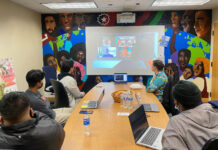 Global Connections Student Leadership brings students of all backgrounds together Several students sit around a table during a videoconference