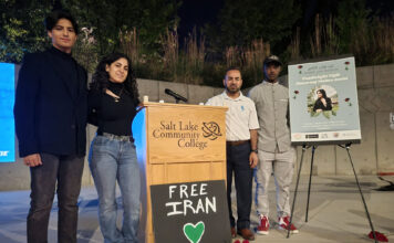 School multicultural groups hold a vigil to honor Mahsa Amini Four people stand by a Salt Lake Community College podium with a "Free Iran" sign and a poster for the Mahsa Amini candlelight vigil