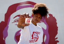 Murals paint memories of those lost to police violence across the US Rae Duckworth holds a "Justice for Bobby" sticker near a mural in Salt Lake City