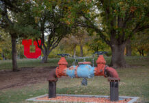 Utah universities work to alleviate water crisis through conservation efforts Water fixture with red U in background