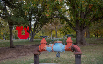 Utah universities work to alleviate water crisis through conservation efforts Water fixture with red U in background