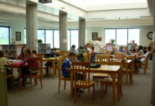 As educators leave at increasing rates, advocates and students express worry Students sit at tables in a library
