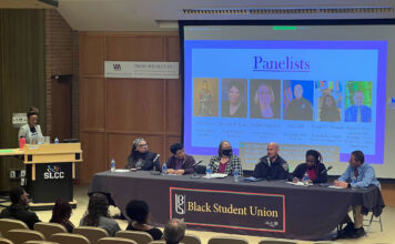 Black Student Union hosts panel on racism and hate speech Six people seated at a Black Student Union table for a panel discussion on racism and freedom of speech