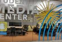 After the shooting in Michigan, students question SLCC’s safety protocols Glass panels forming a wall of an office suite