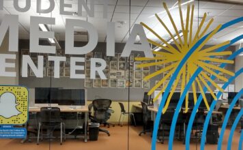 After the shooting in Michigan, students question SLCC’s safety protocols Glass panels forming a wall of an office suite