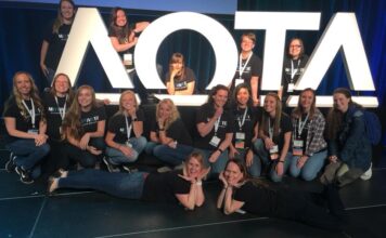 Overlooked club conference connects student groups SOTA club takes a group photo with AOTA block letters