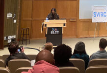 NYT bestselling author, Utah native shares her work of Black identity for SLCC reading Rio Cortez on stage behind podium reading poetry