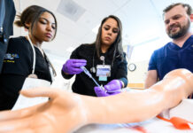 Nurses are becoming more scarce. Here’s how SLCC is preparing them for success Nursing student Barbara, center, learning intravenous applications