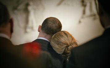 Students facing grief have access to support resources Woman resting head on man's shoulder during a service