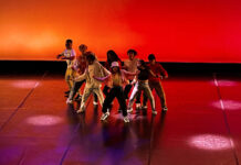 Dance students showcase their final work for ‘Body Language’ concert Eight dancers perform underneath red and orange lighting