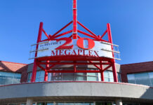 Students and staff can take a break this summer with free movie tickets Facade for Megaplex 20 at The District