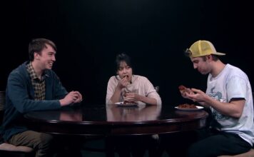 What’s Bruin’ – Hot Wing Challenge Eli Hansen, Asia Soth, and Eric Drubbing seated at a table