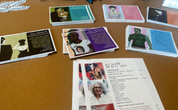 Womxn share stories about identity and struggle in new anthology series Information cards and pamphlets placed on a table